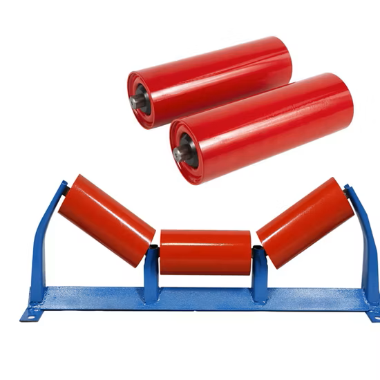 Red steel conveyor idler rollers on a troughing frame
