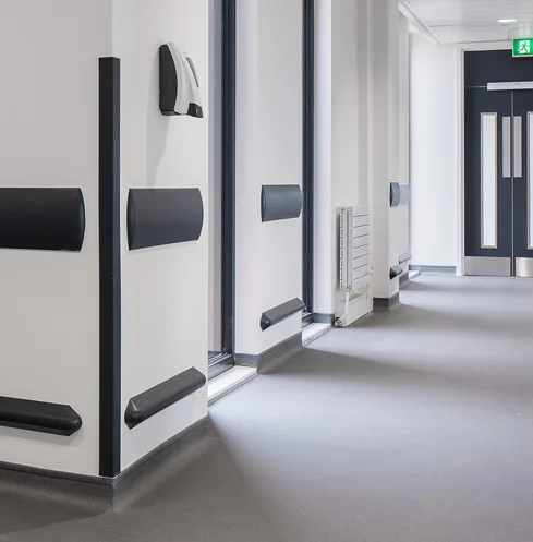 Wall guard installation in a hospital corridor
